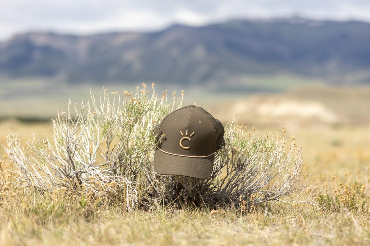 The Stockyard Cap, a brown Cavvy performance rope hat photographed in sagebrush